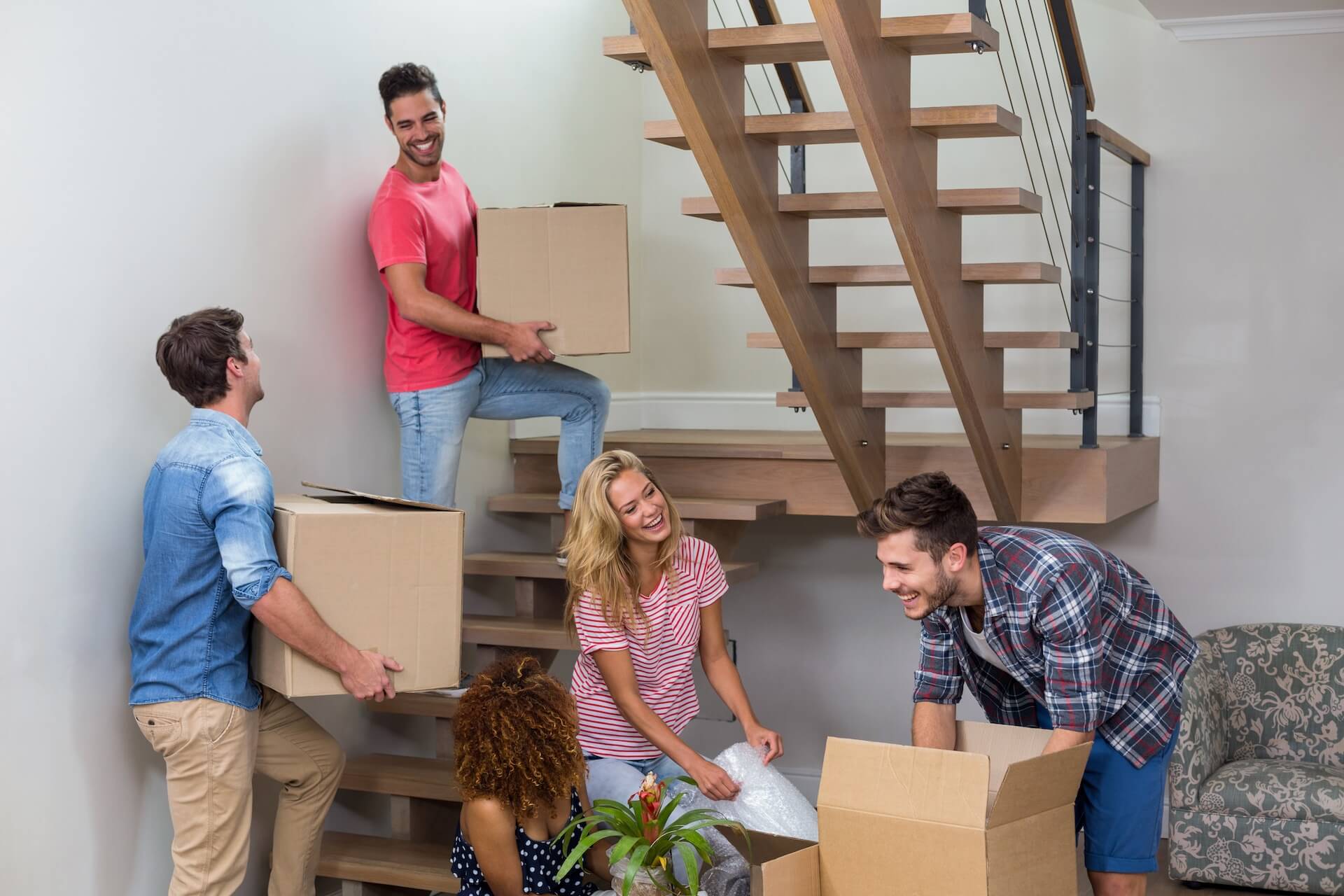 People packing and deciding what to keep for relocating internationally