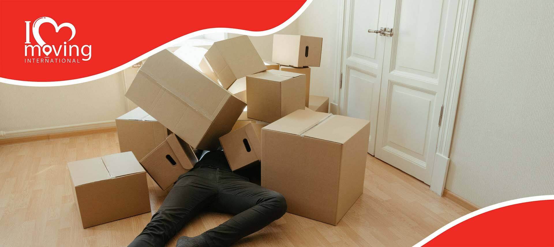 A man trapped under a pile of boxes while packing for long-distance moving