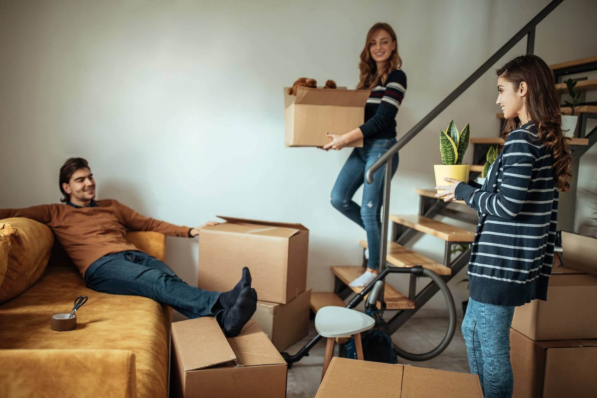 Three people relocating a place as if they are the best movers