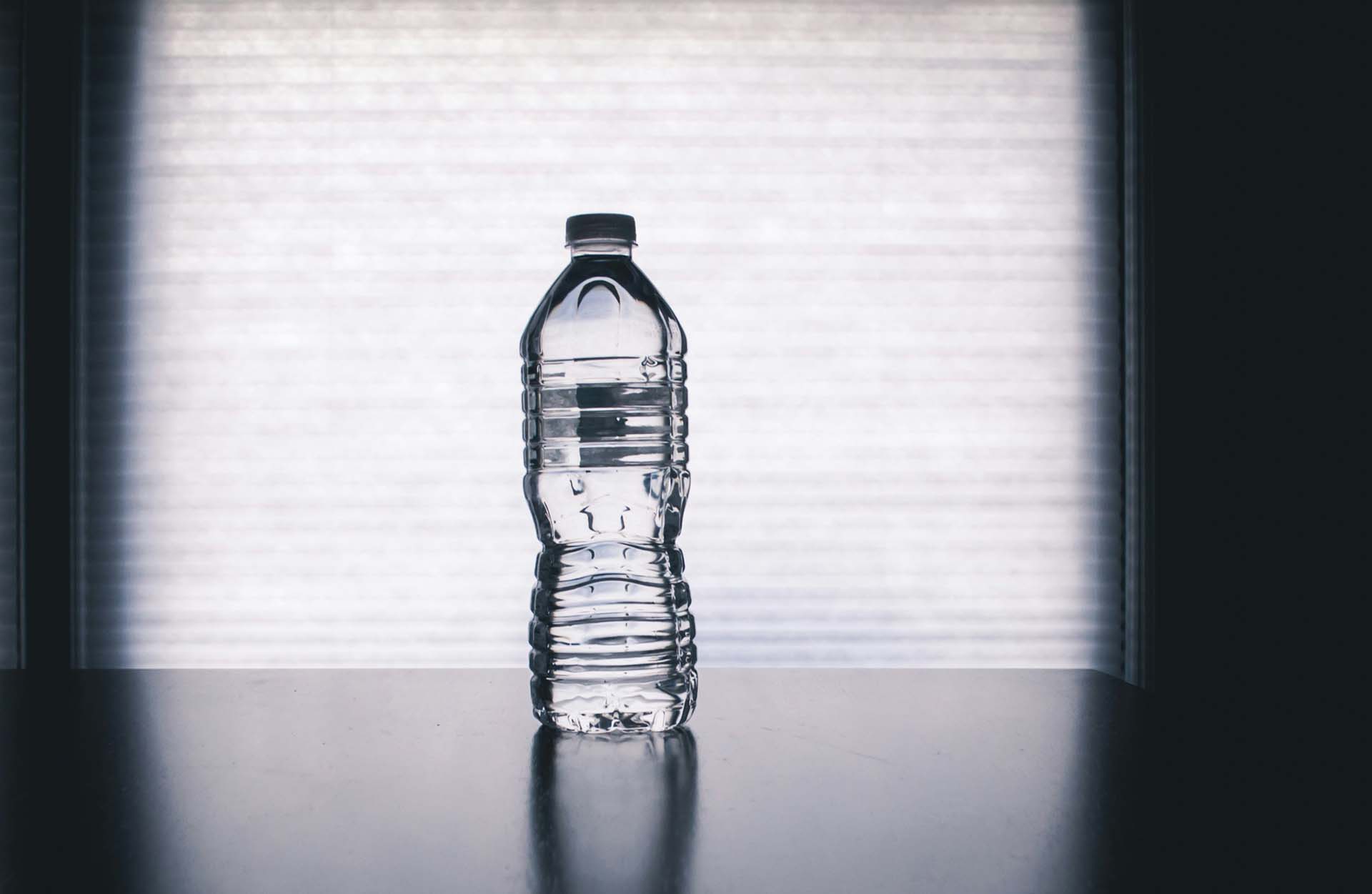 A bottle of water on a counter