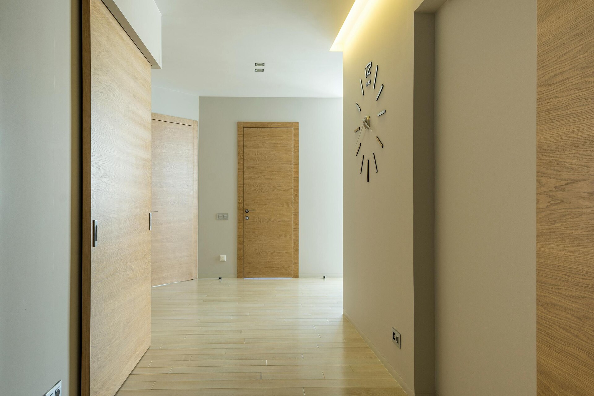 An empty hallway with a wooden floor