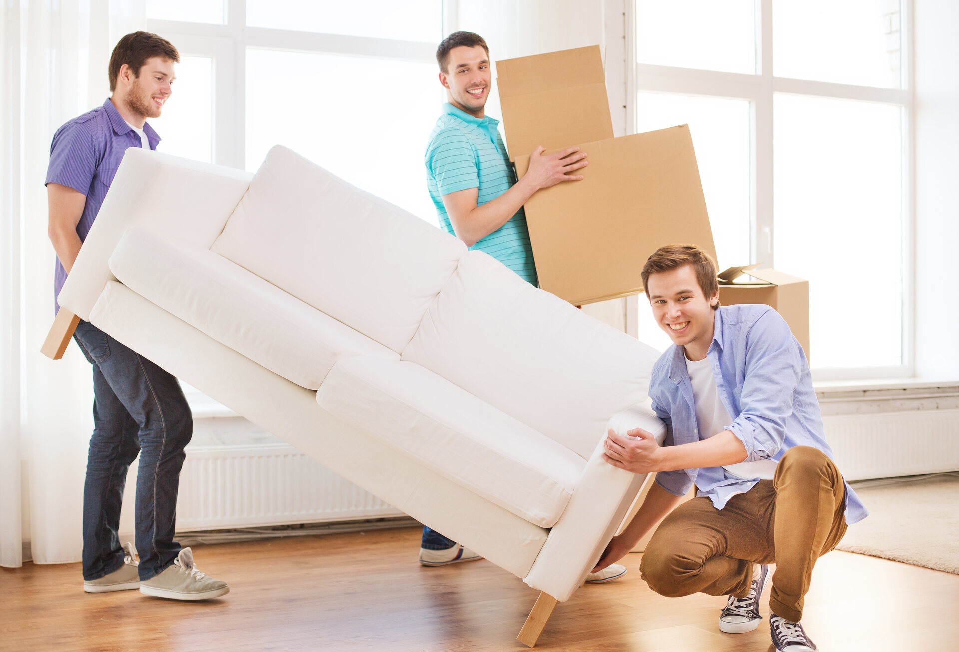 Friends moving a sofa