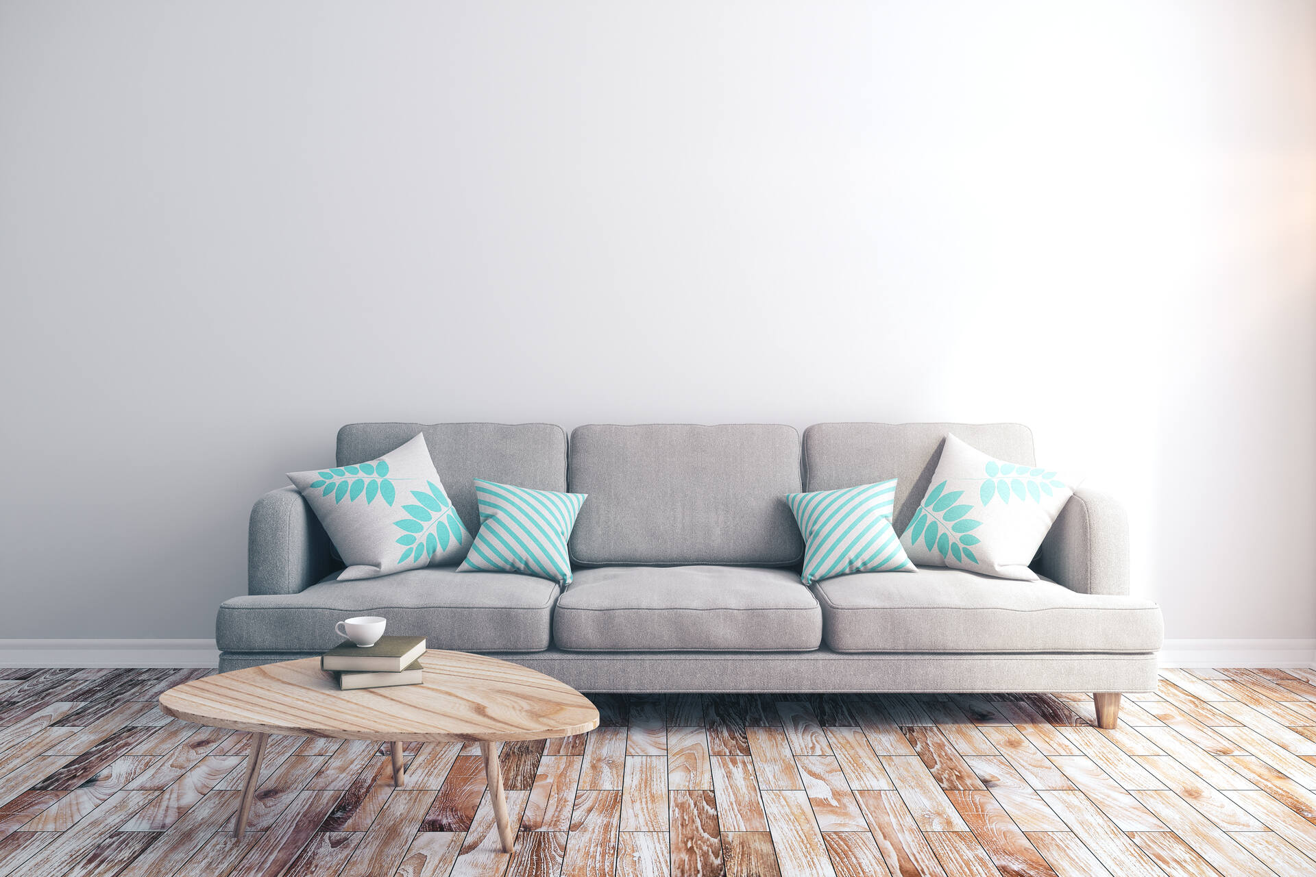 Grey sofa with cushions and a wooden table