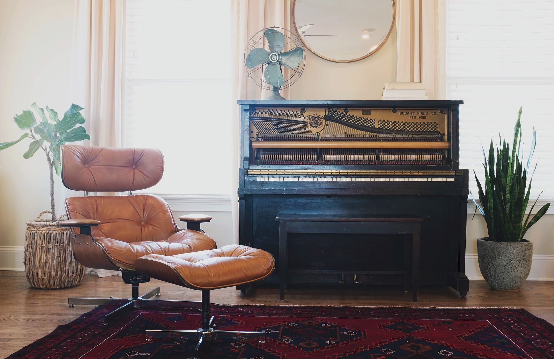 Living room with a piano, chair and fan